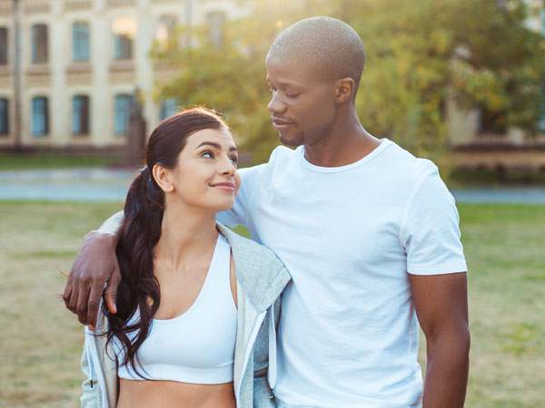 Man looking down at his woman